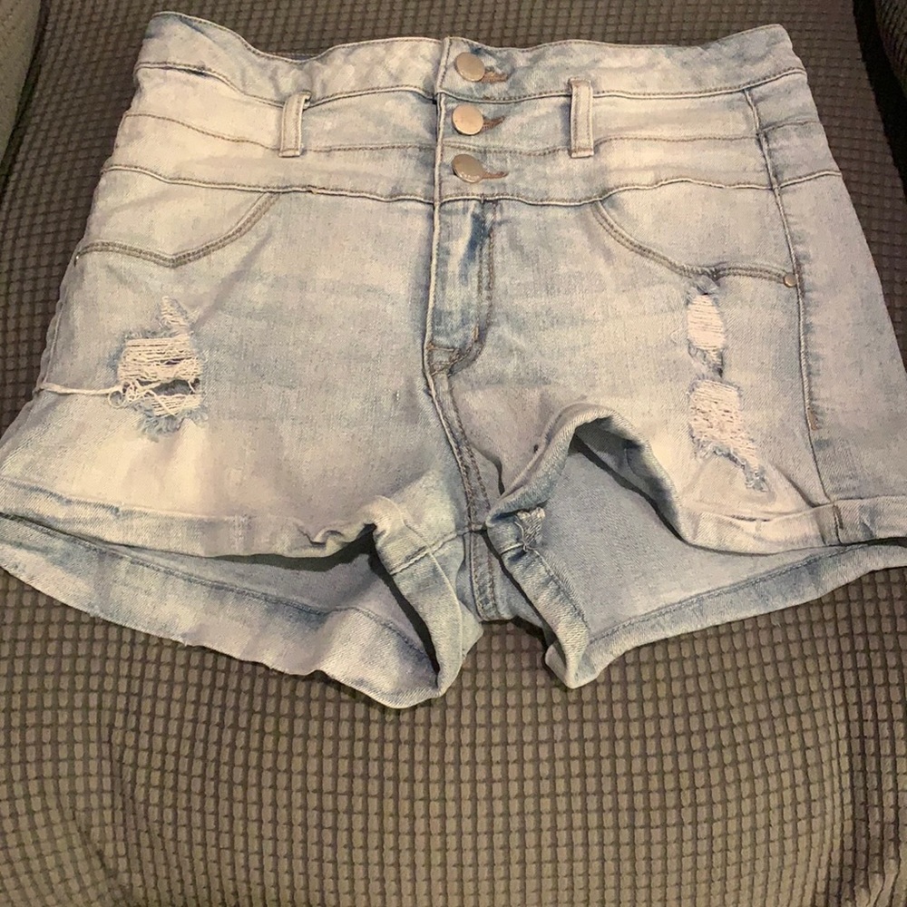 High wasted three button distressed denim shorts